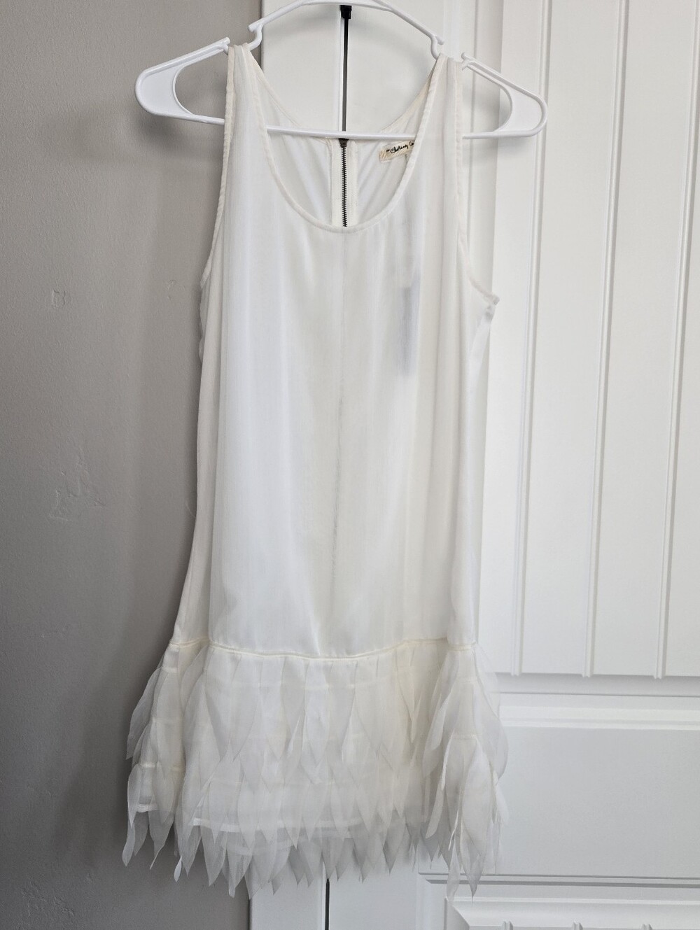 the clothing company White Sleeveless Chiffon Dress with Gray Tag Detail